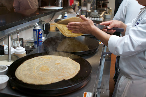 The crêpes are expertly flipped.