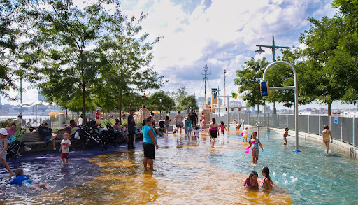 The playground has water features, however, that day, there was a drain problem, forming a wading pool.