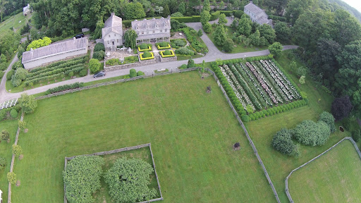 This beautiful aerial shot of my home, which I call the Winter house (center), includes the flower room, carport and studio in the one long structure to the left, the Summer house to the far right, one of the horse paddocks and my beautiful peony garden in full bloom below.
