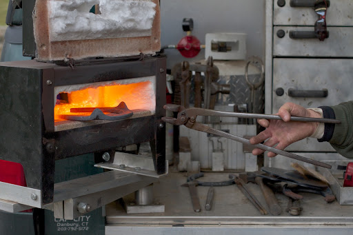 Throughout the fitting process, the shoes are heated red-hot in a forge, which makes the steel pliable for shaping. The forge temperatures reach between 1400º and 1800º Fahrenheit.