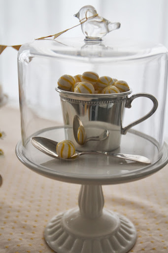 Baby Shower: Sterling silver baby cup (Reed & Barton) filled with striped candy (nycake.com) featured in bird dome with cupcake stand (Martha Stewart Collection at Macy's, $40)