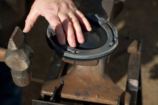 The trimmed pad is attached to the shoe with nails.