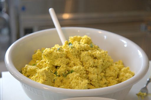 Eggs were scrambled in butter with lemon juice, salt, and pepper until fairly stiff.