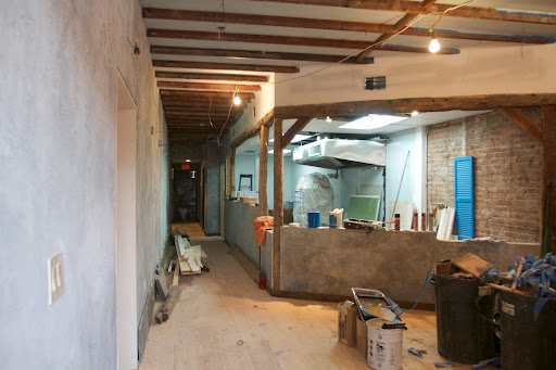 I was given a tour during the construction process. The seating area was designed to look like an outdoor cafe with an open kitchen.