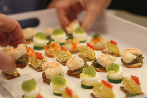 Other cold hors d'oeuvres included, chicken curry on baguette with coconut flakes, white bean puree and root vegetable crostini, and eggplant caviar and shrimp on toast.