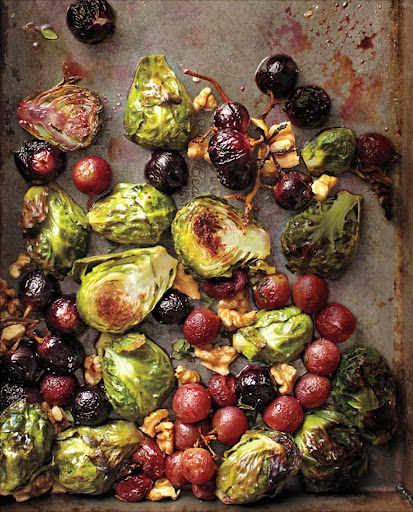 Roasted Brussels Sprouts and Grapes with Walnuts - The brussels sprouts and grapes are roasted and then drizzled with balsamic vinegar to incorporate the flavorful bits from the bottom of the baking sheet and then topped with toasted walnuts.