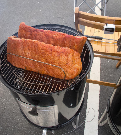 The team rigged a thermometer to keep their eye on temperatures. For ribs, the rule of thumb is ‘low and slow’, about 225 degrees for 5 hours, with some apple wood chunks thrown in for flavor.
