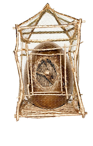 Martha Stewart - Inspired by Danish Artist, Tage Anderson. The cage was made of branches from my Bedford farm and brass chicken wire. The egg was spray painted with very shiny
