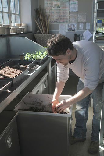 Amazed by how fast all the seedlings are growing, Ryan has a lot of repotting to do. He's transferring the artichokes into peat pots.
