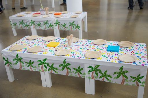 Oriental Trading is a great source for party supplies, like the fun palm tree tablecloths shown here.
http://www.orientaltrading.com/palm-tree-tablecloth-roll-a2-13601196-12-1.fltr?Ntt=palm%20tree%20tablecloth