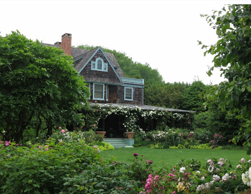 This is my home on Lily Pond in East Hampton. This photo was taken last June, when the roses were in full bloom.