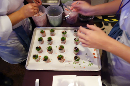 These gals were working feverishly assembling a rather complicated hors d'oeuvre of crabmeat.