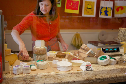 Rather than having a refrigerated case to display her cheeses, each morning, Audrey sets out her selections on a cold slab of marble.