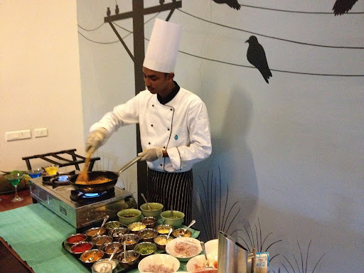 Chef Nishad demonstrated the preparation of the first dish, Okra Masala. Okra is fried and added to a sauce of chopped tomato, chili powder, ground coriander, turmeric, ginger, garlic, and curry leaves. Cashew nut paste and coconut milk give the sauce a creamy texture.