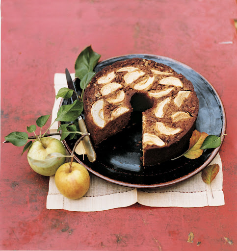 Applesauce Coffee Cake - Making this rustic coffee cake is a great way to use up an abundance of apples. Some are used to make an applesauce that's mixed into the batter; others are sliced and layered atop the cake before baking along with a delicious oat-cinnamon crumb topping.
