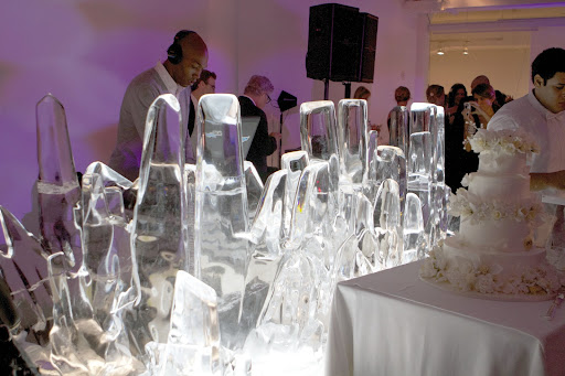 DJ Trife (Chris Williams) jamming behind this amazing ice sculpture. The extraordinary wedding cake is by Syliva Weinstock. http://www.sylviaweinstock.com