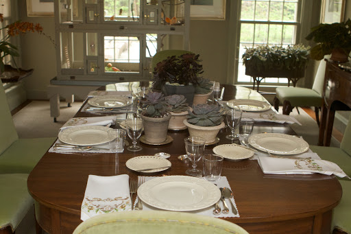 A lovely table was set in the small dining room where a large cage filled with red factor canaries is located. The canaries serenaded throughout lunch. The table was decorated with succulents from the greenhouse.