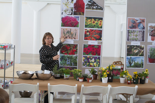 The children were now ready to put the ceramic pots that they decorated earlier to use. Rita Christiansen taught a gardening class to prepare them for planting!