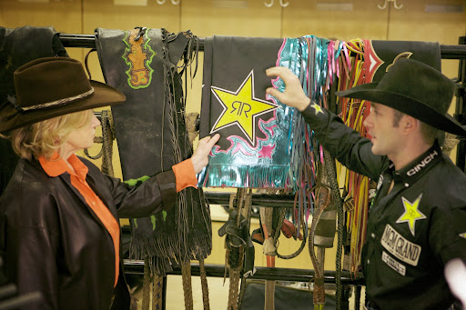 The fringe on the sides, a traditional decorative accent, helps the rider bring the judges' attention to his legwork. Shane likes combining colors and using flashy metallics in his designs.