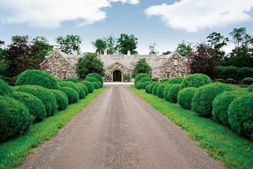 This is what the boxwood allee leading to the stable looked like last June when Equestrian Quarterly came to visit my farm. I had this 8-stall European-style stone barn built about 10 years ago.