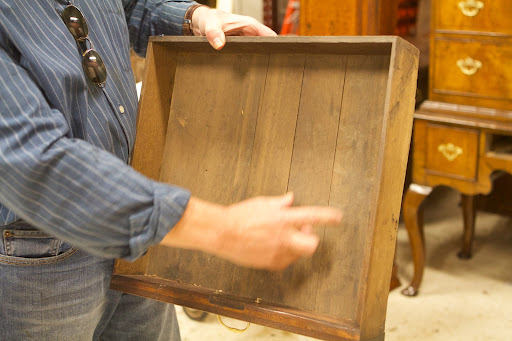 Richard can approximate when this chest was made because prior to 1725, the bottom drawer liners were built spanning front to back. The direction was changed spanning side to side to give the drawer more strength.