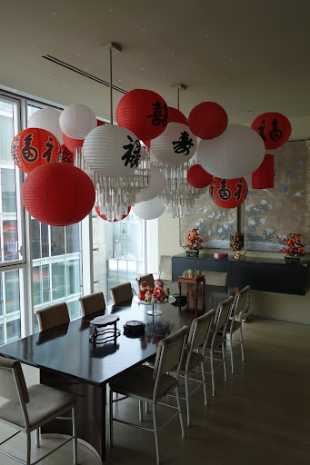 The paper lanterns were installed using 3M removable clear plastic Command Hooks and clear fishing line. The lanterns appear to float in air.