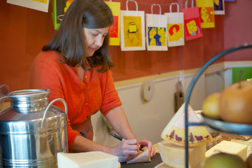 Audrey believes that every cheese purchase should look like a gift, and each piece is carefully wrapped.