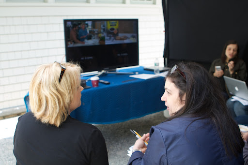 Amy Wilkins and Vanessa Goldberg-Drossman, MSLO’s VP of Sales Development, review the progress on the monitor set up right outside.