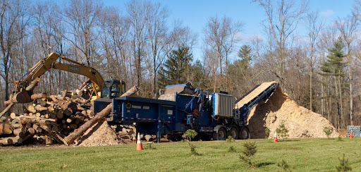 Because we had so much volume, we hired a company that brought in a horizontal grinder, a powerful machine used in construction and demolition grinding.