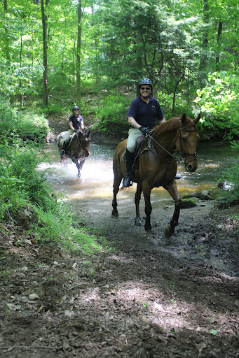 Water crossing can be tricky on horseback because of slippery rocks to maneuver around and the depth of the water is sometimes hard to judge. This is Nina Eisenman and Vance Brown riding Indy and Wapiti.
