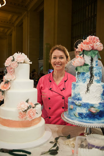 Amy with her stunning cakes. She recommends using silicone molds, which can be used over and over, to form these beautiful blooms.