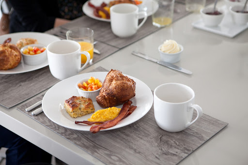 The breakfast was hot out-of-the-oven popovers, buttermilk biscuits, bacon, scrambled eggs, and fresh fruit salad.