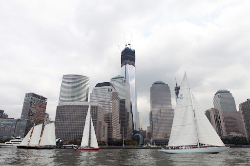 Some of the other 12-meter and J/24 boats in the regatta sailing by the skyline of lower Manhattan with the new Freedom Tower under construction