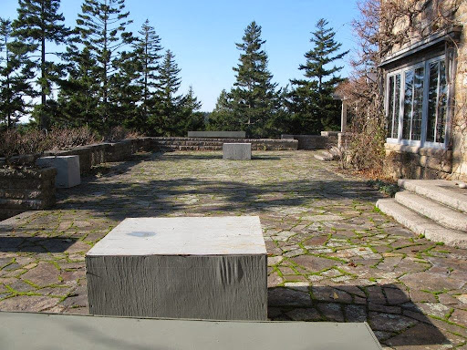 To protect the large urns on the terrace from the winter elements, they are covered with plywood boxes.